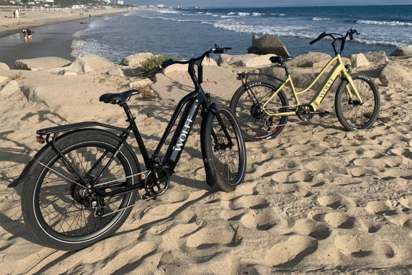 Two Wolff E-Bikes parked at the beach