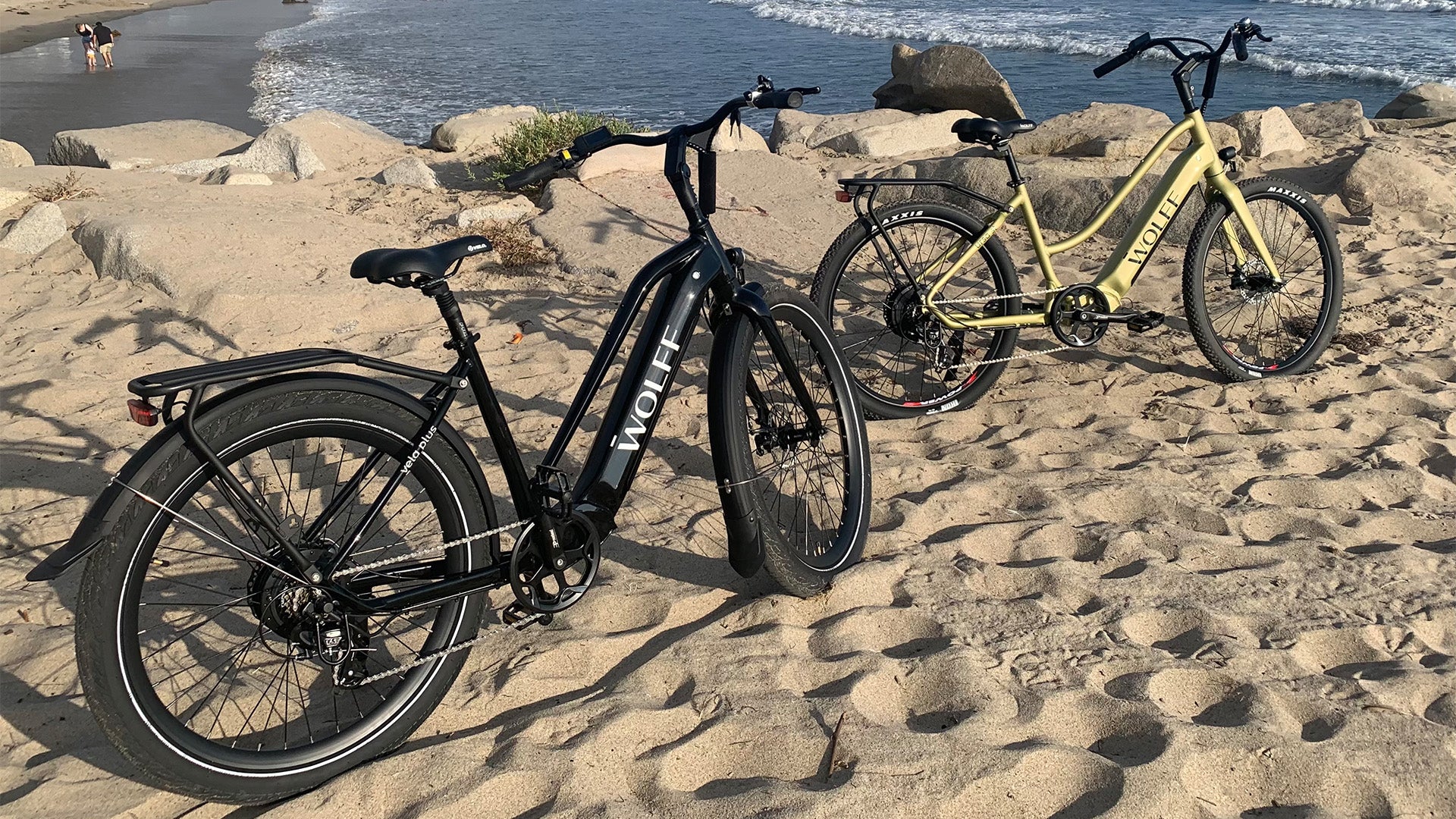 two Wolff e-bikes parked at the beach
